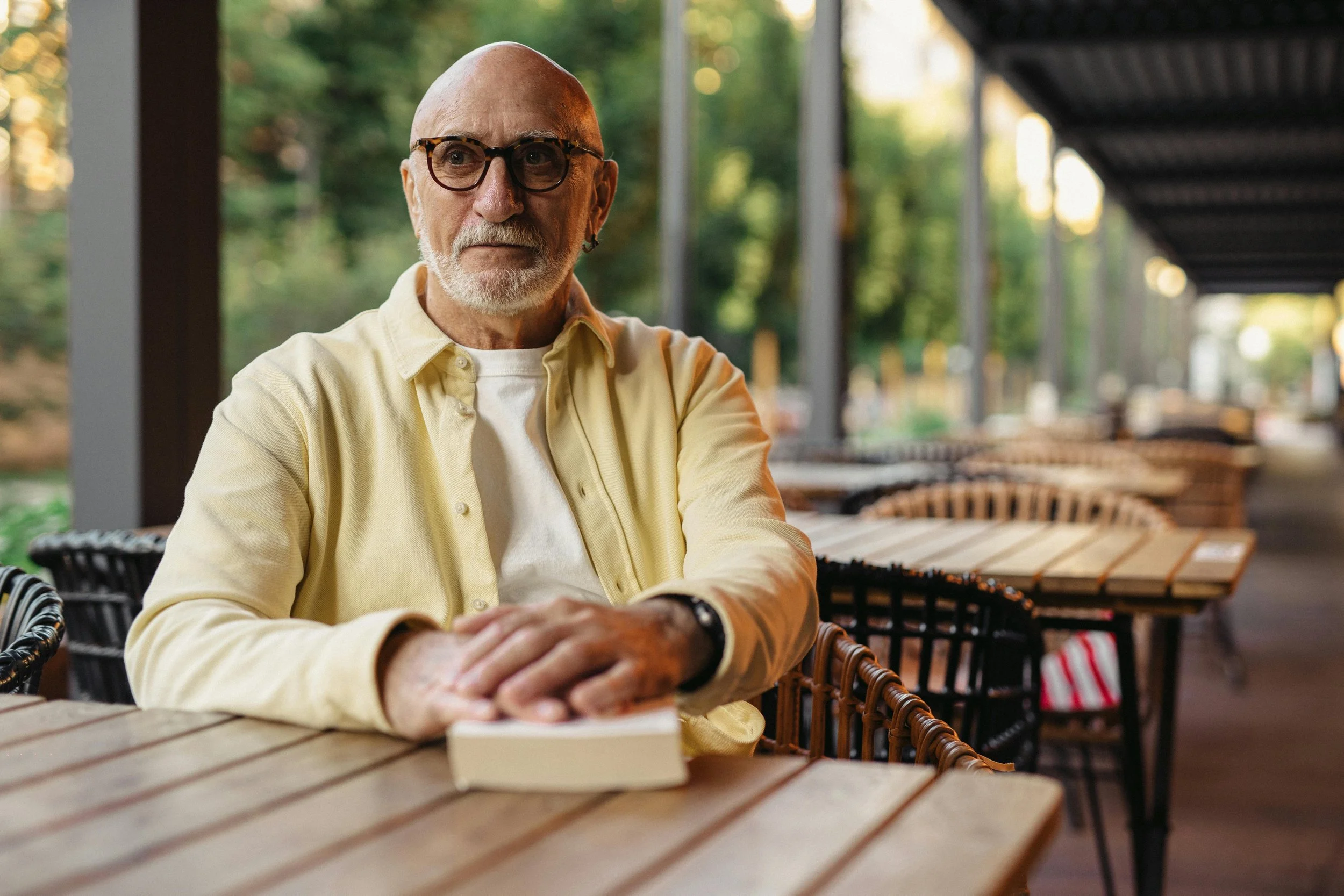 An older man relaxing in a café
